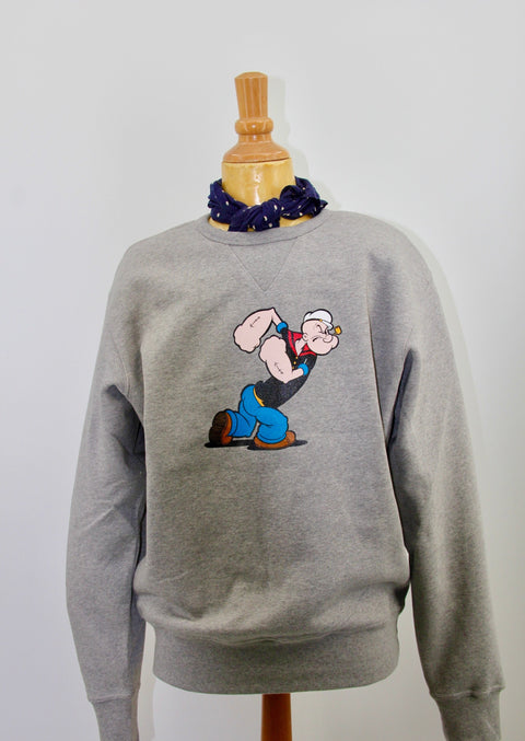 FRONT VIEW OF CREWNECK SWEATSHIRT IN GREY MELEE WITH POPEYE GRAPHIC ON THE FRONT 