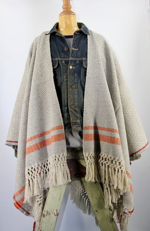 WOVEN PONCHO WITH HANDMADE FRINGES, ECO WOOL