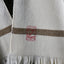 DETAIL OF PONCHO LORIGA; BEIGE DETAIL (STRIPE) AND BEAUTIFUL EMBROIDERY STAMP IN RED (SCHOOLOFLIFEPROJECTS)