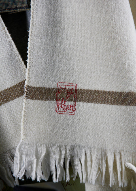 DETAIL OF PONCHO LORIGA; BEIGE DETAIL (STRIPE) AND BEAUTIFUL EMBROIDERY STAMP IN RED (SCHOOLOFLIFEPROJECTS)